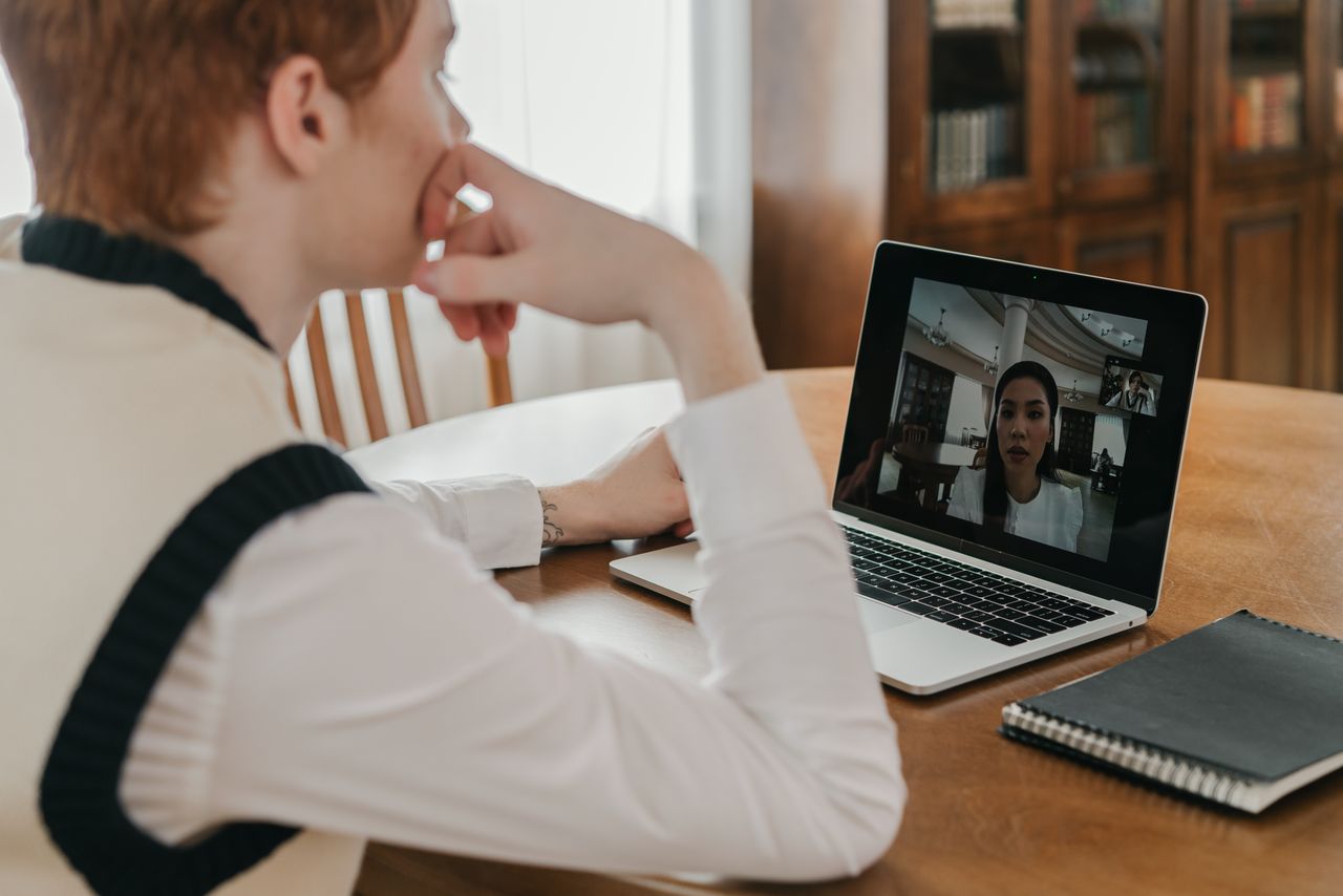 Project manager in a daily standup call with an offshore development team